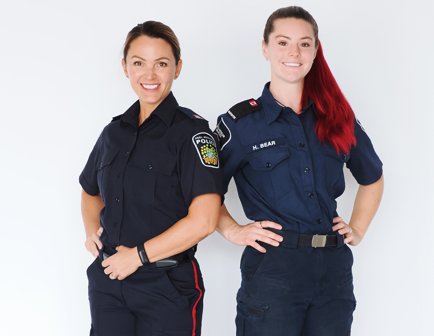 Vanessa McHugh in her police officer uniform and Hélina Bear in her firefighter uniform